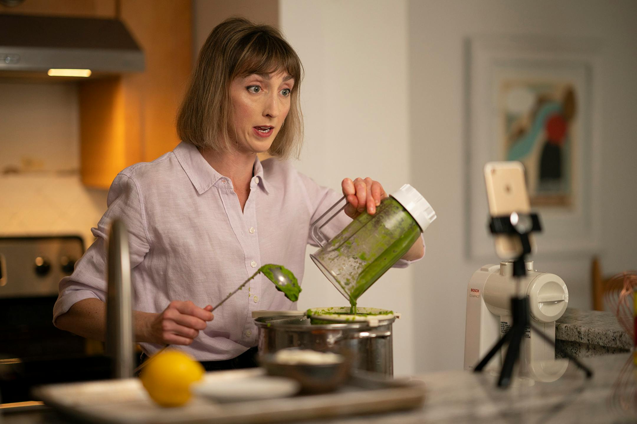 Chef Karyn Tomlinson spoke to the camera while straining pureed asparagus for the soup she was making. Since the pandemic began, former Corner Table chef Karyn Tomlinson has been a prolific poster to Instagram, offering free cooking lessons with her show "Karyn's Quarantine Kitchen." She was photographed producing a segment on preparing pureed soups Thursday afternoon, April 23, 2020 in the kitchen of her condo.