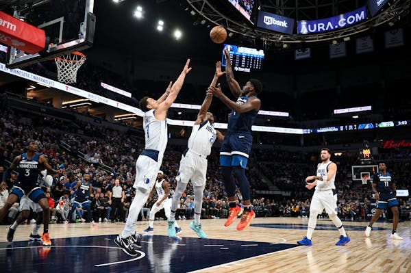 Minnesota Timberwolves guard Anthony Edwards (1) scores a basket against the Dallas Mavericks during the first half Wednesday, Dec. 21, 2022 at Target