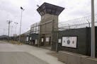 FILE - In this June 7, 2014, file photo, the entrance to Camp 5 and Camp 6 at the U.S. military's Guantanamo Bay detention center, at Guantanamo Bay N