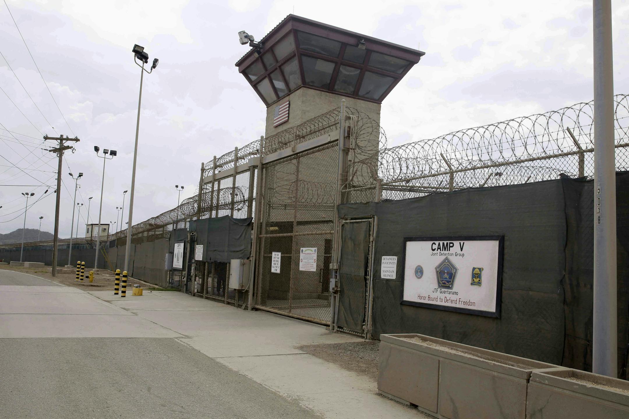 FILE - In this June 7, 2014, file photo, the entrance to Camp 5 and Camp 6 at the U.S. military's Guantanamo Bay detention center, at Guantanamo Bay Naval Base, Cuba. Oman's Foreign Ministry said in a statement Monday, Jan. 16, 2017, it accepted 10 inmates from the U.S. prison at Guantanamo Bay ahead of U.S. President Barack Obama leaving office, part of his efforts to shrink the facility he promised to close. There was no immediate word from the U.S. Defense Department about the transfer. (AP P