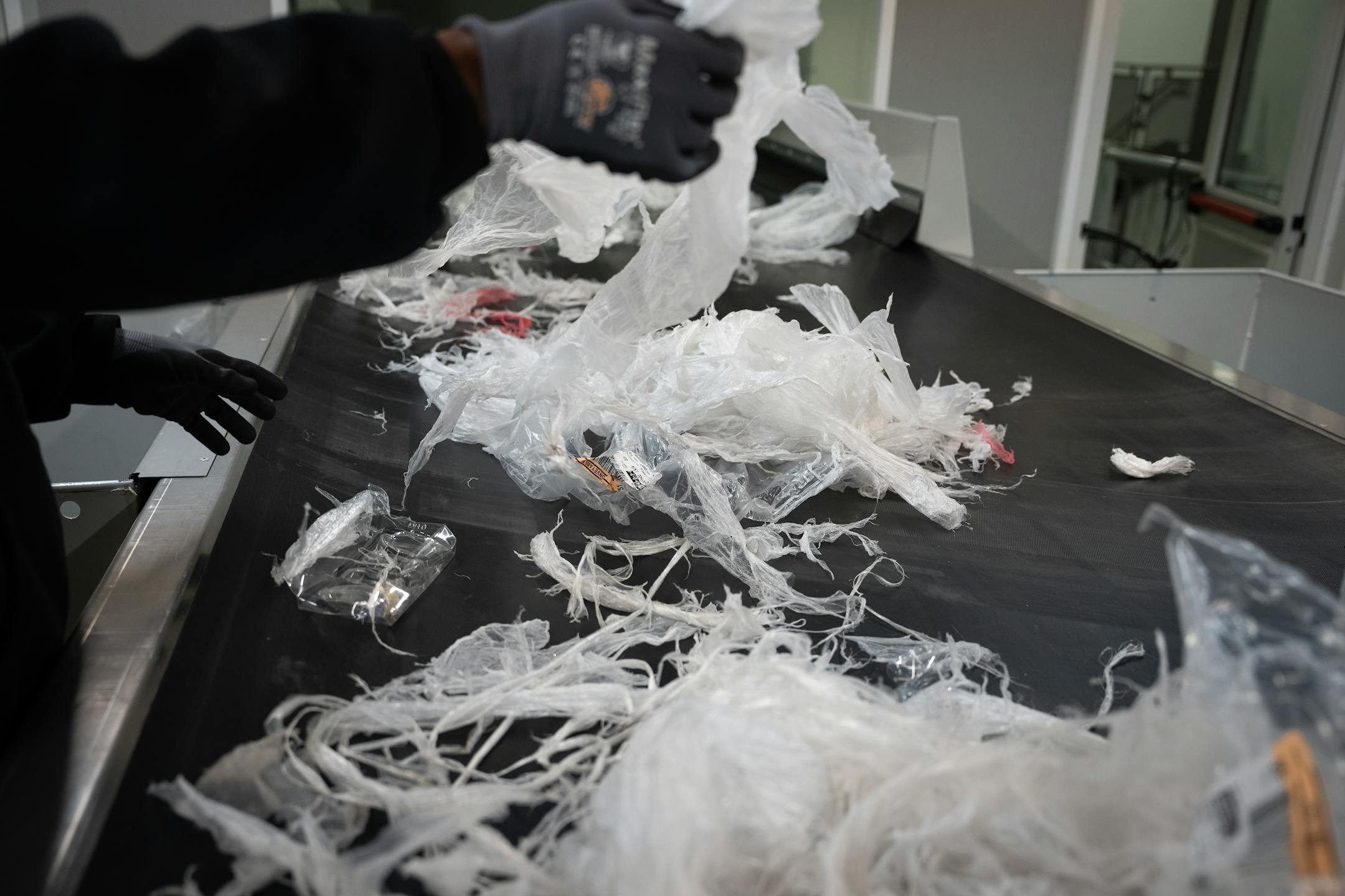 Employees hand sort plastic at the Myplas USA plastic recycling facility in Rogers, Minn., on Tuesday, Dec. 12, 2023.
