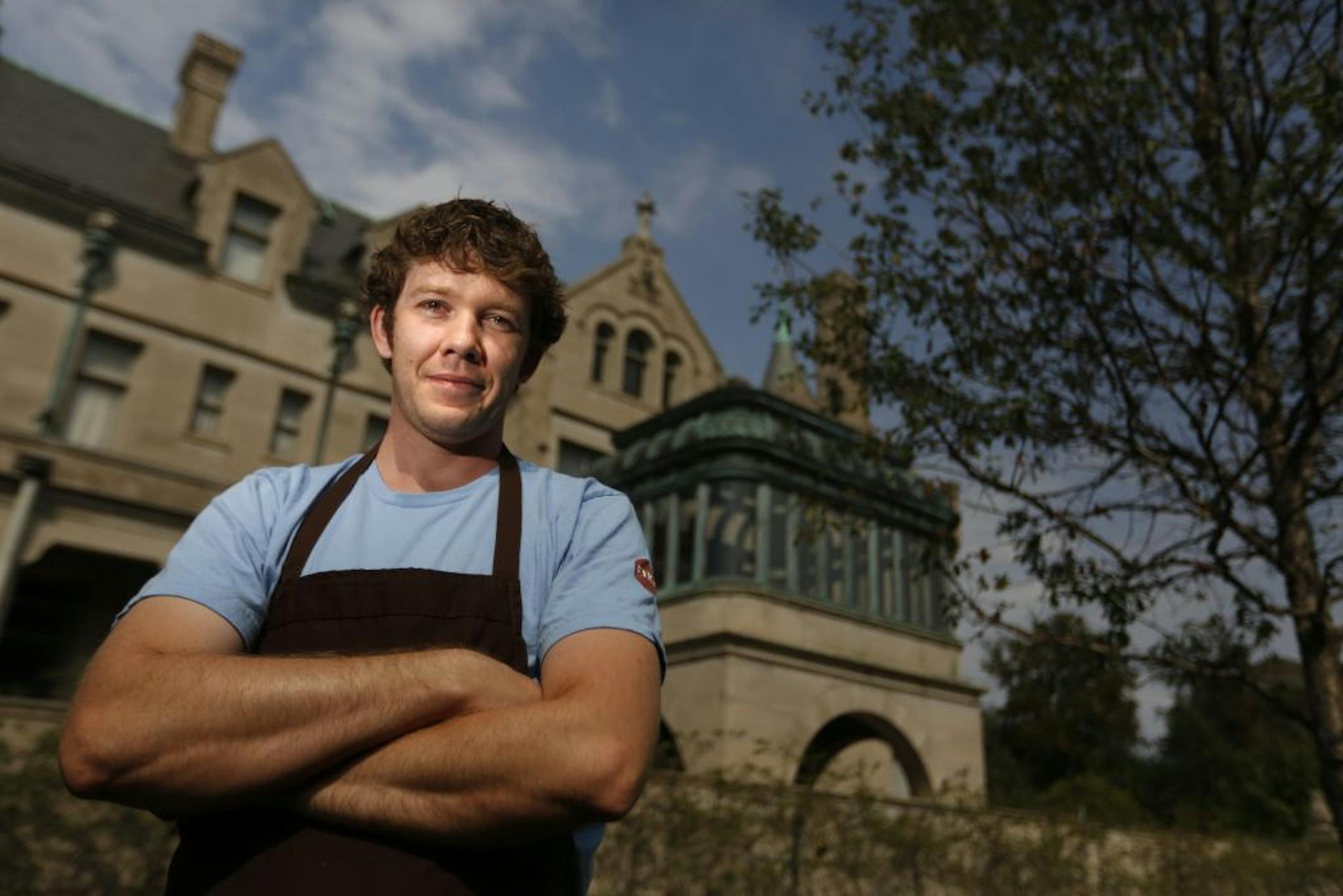 At Fika, the restaurant in the new wing of the American Swedish Institute in Minneapolis, chef Michael Fitzgerald in front of the Turnblad mansion .