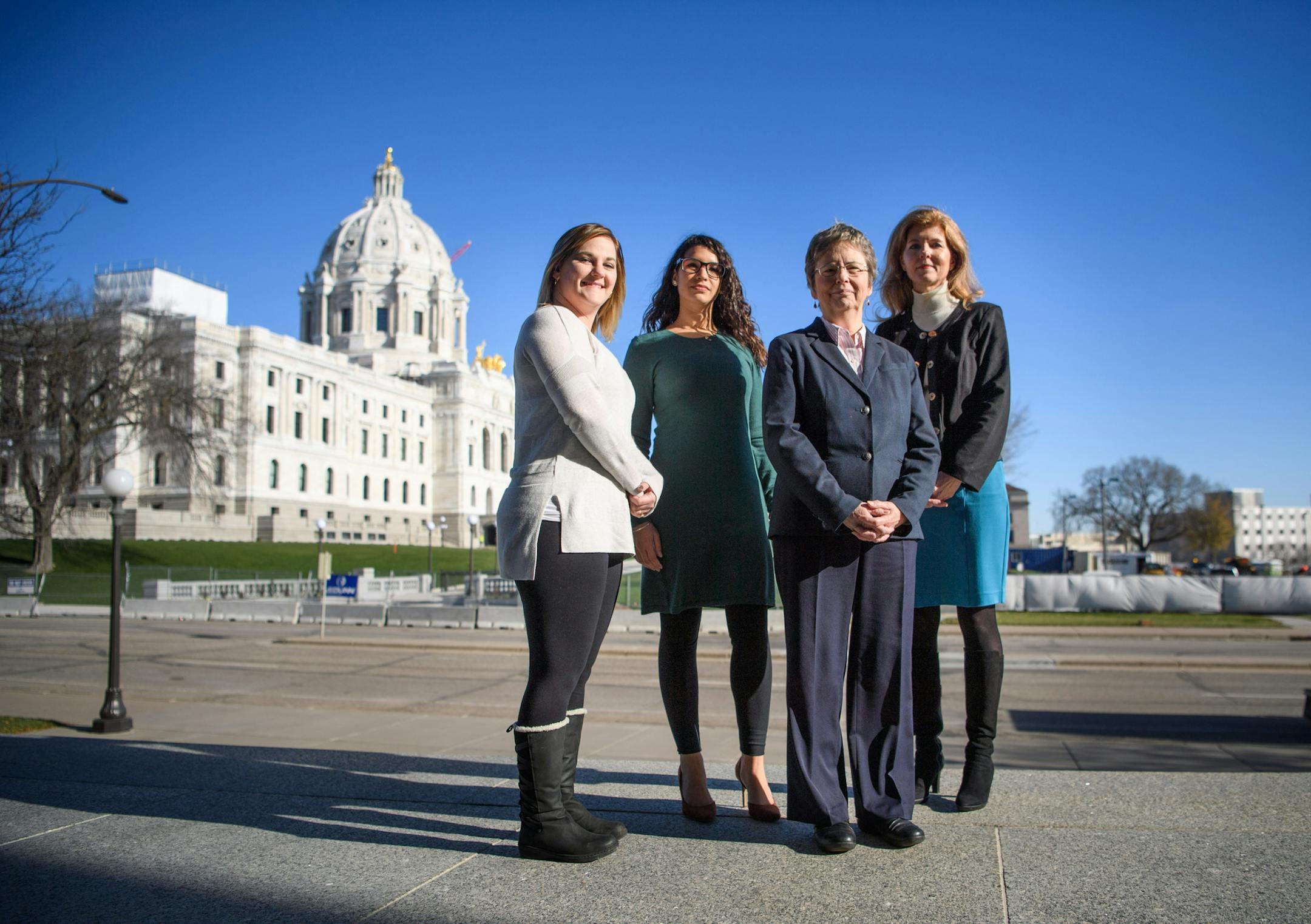 Newly elected lawmakers Erin Koegel, DFL-Spring Lake Park, Erin Maye Quade, DFL-Apple Valley and Regina Barr, R-Inver Grove Heights, left to right, are part of a wave of women joining the Minnesota House. Carolyn Laine, DFL-Columbia Heights, in purple, is the only new female member of the Senate.