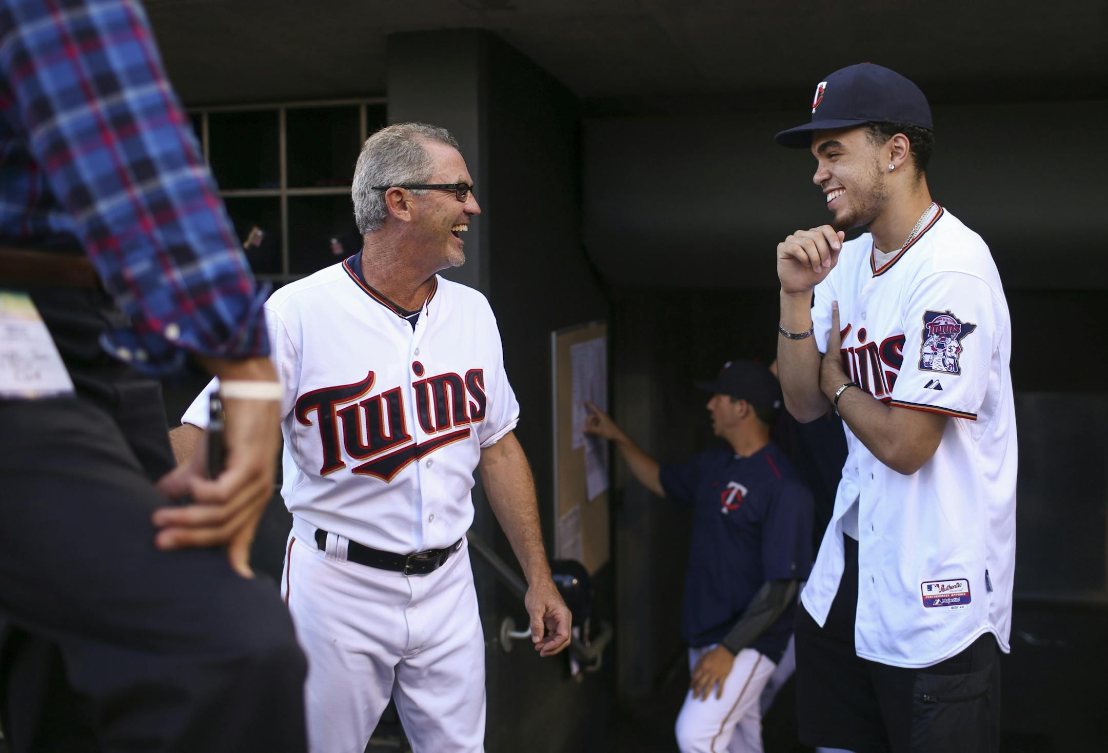 Twins third base Gene Glynn, who earned Minnesota's very 1st "Mr. Basketball" award in 1975, visited in the dugout before Thursday night's game with a more recent recipient, Minnesota Timberwolves guard Tyus Jones. Jones threw out the ceremonial first pitch Thursday evening.