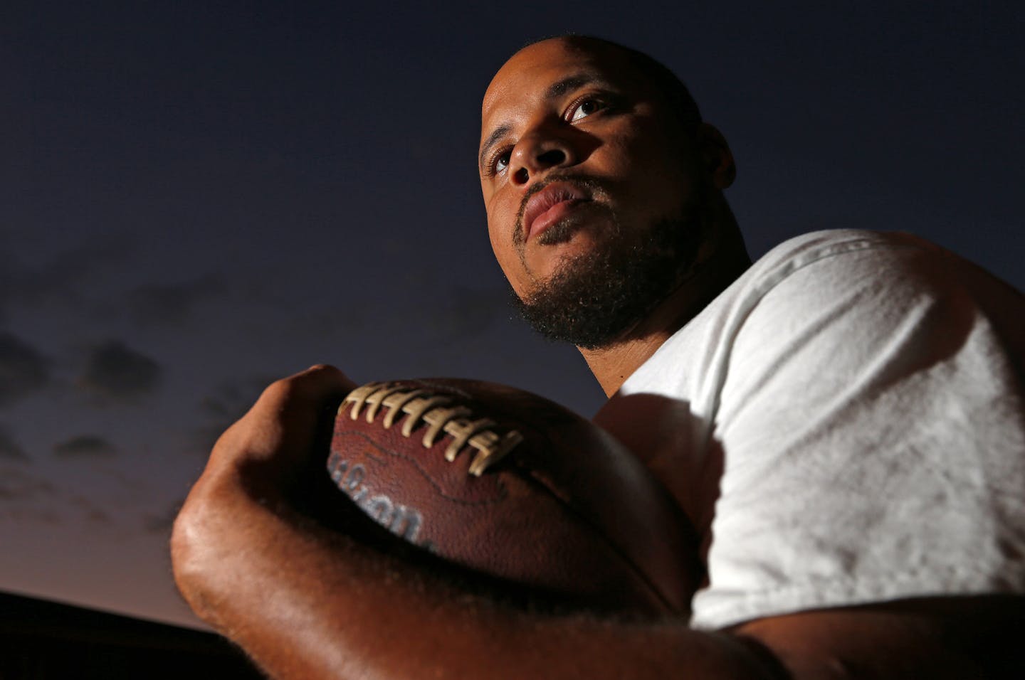 SPECIAL TO MINNEAPOLIS STAR- TRIBUNE-- Portrait of Asad Abul-Khaliq at his home in Linden, N.J., Saturday, Sept. 26, 2013. Abdul-Khaliq was the quarterback for the University of Minnesota in a 'historic' 2003 game against Michigan. Abdul-Khaliq is now a train conductor for New Jersey Transit. (AP Photo/ Rich Schultz) ORG XMIT: NJRS205