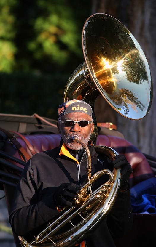Alan Page and his sousaphone are known for serenading Twin Cities Marathon runners in Minneapolis' Kenwood neighborhood.