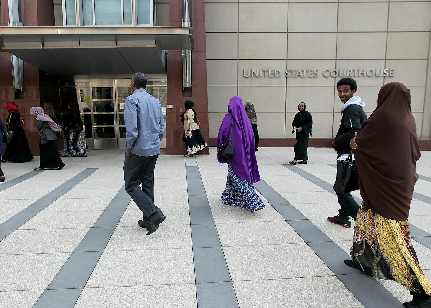 Family members of young Somali men standing trial made their way into the opening day of the ISIL recruit trial, in front of the United States Courthouse, Monday, May 9, 2016 in Minneapolis, MN.