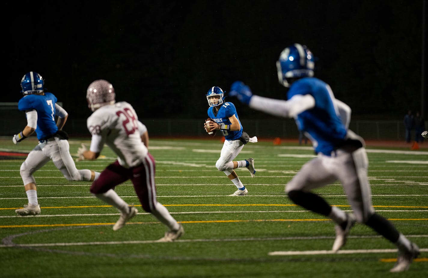 Woodbury quarterback George Bjellos (16) spotted his intended target, receiver Joey Gerlach (6), right, before tossing him a fourth quarter touchdown pass Thursday, Nov. 11, 2021 in Eden Prairie. The Maple Grove Crimson defeated the Woodbury Royals 34-12 in a MSHSL Class 6A football state tournament quarterfinal game Thursday, Nov. 11, 2021 night at Eden Prairie High School in Eden Prairie. ] JEFF WHEELER • Jeff.Wheeler@startribune.com