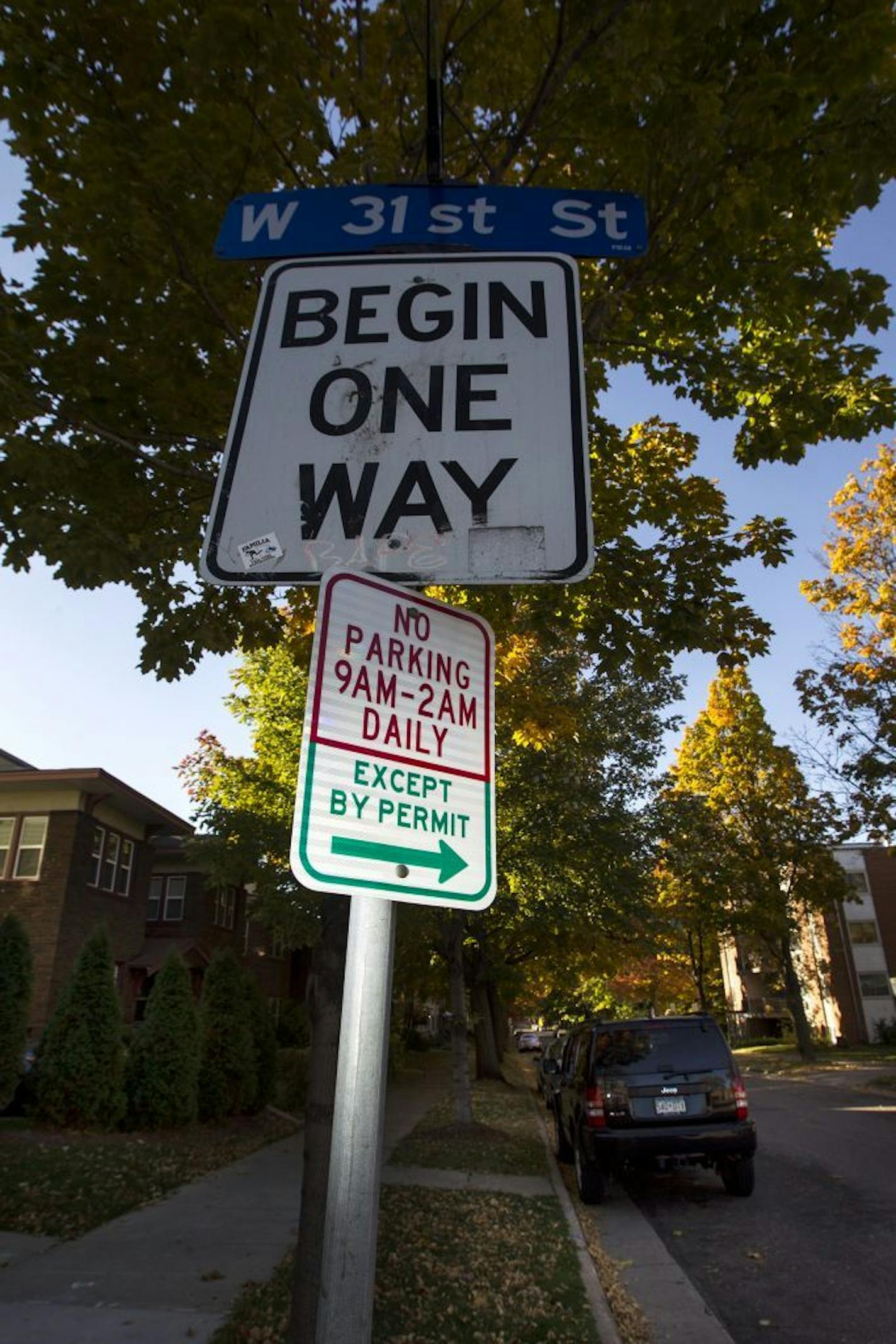 Multiple signs state that only cars with resident permits can park in the 3100 block of Girard Avenue South, but it is the most ticketed location in the city. Photographed October 16, 2014.