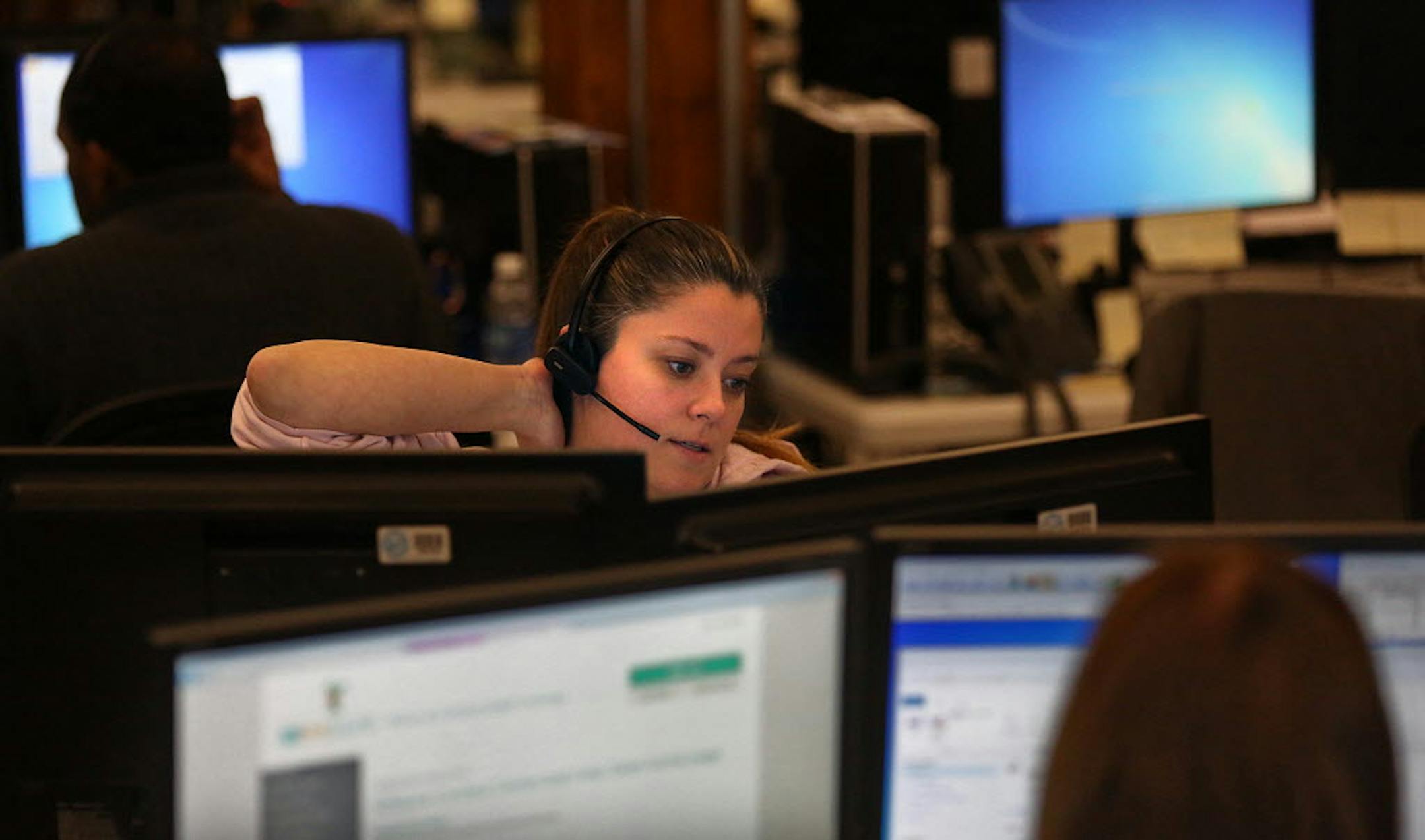 Call center guide Christy Williamson worked the phones on the final day for people to sign up for MNsure.