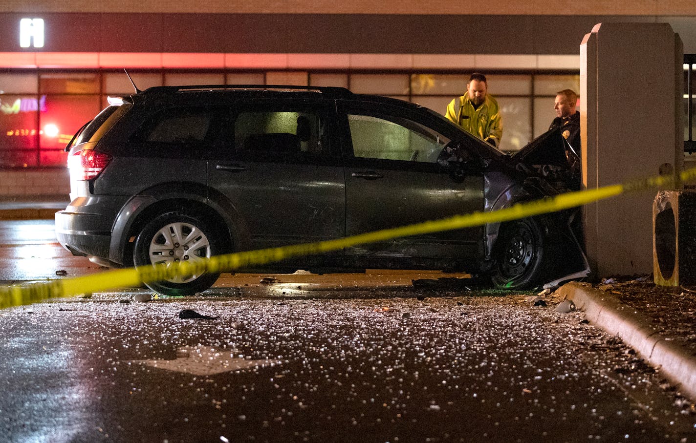 Emergency crews looked over a vehicle involved in an accident on East Lake St. in Minneapolis on Sunday night. ] CARLOS GONZALEZ • cgonzalez@startribune.com – Minneapolis, MN – May 19, 2019, Accident