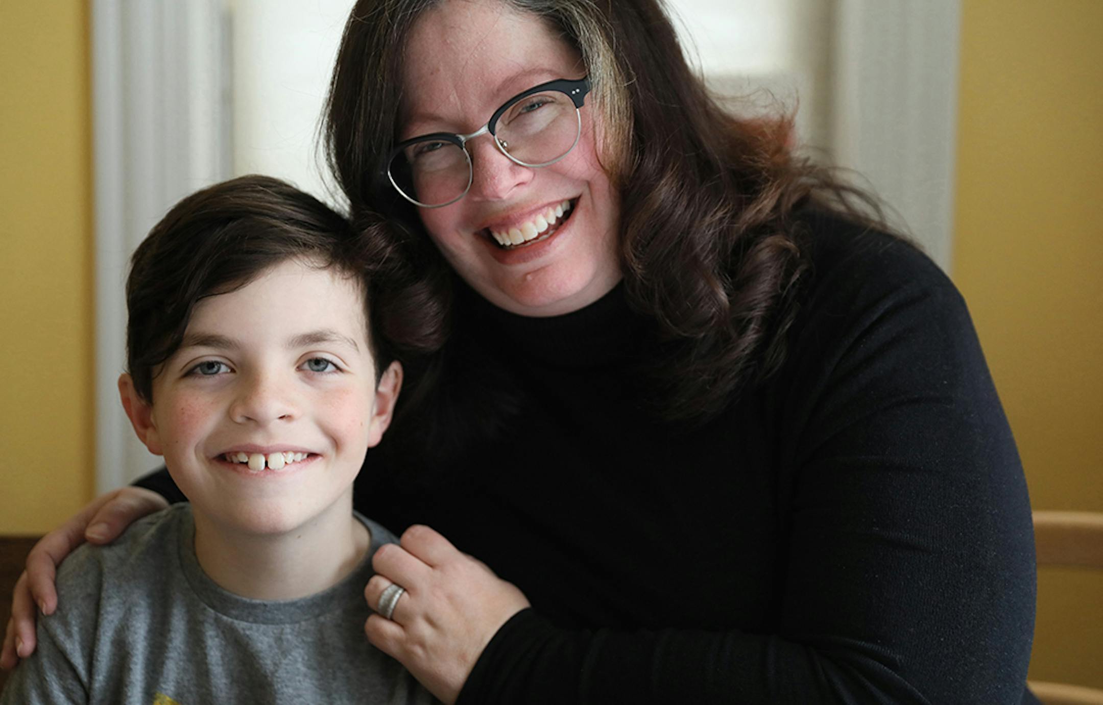 Jay Quirke Hornik, left, 9, poses with his mother Sheila Quirke on Friday, April 13, 2018 in their Chicago home. They planned to travel together Sunday, April 15, 2018 to Washington D.C. for training in a push for more cancer research funding. Sheila's daughter Donna died at age 4 from cancer. (Chris Walker/Chicago Tribune/TNS)