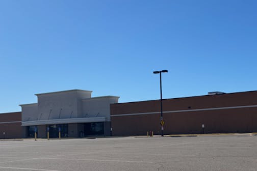 A former JCPenney building stands vacant in a parking lot