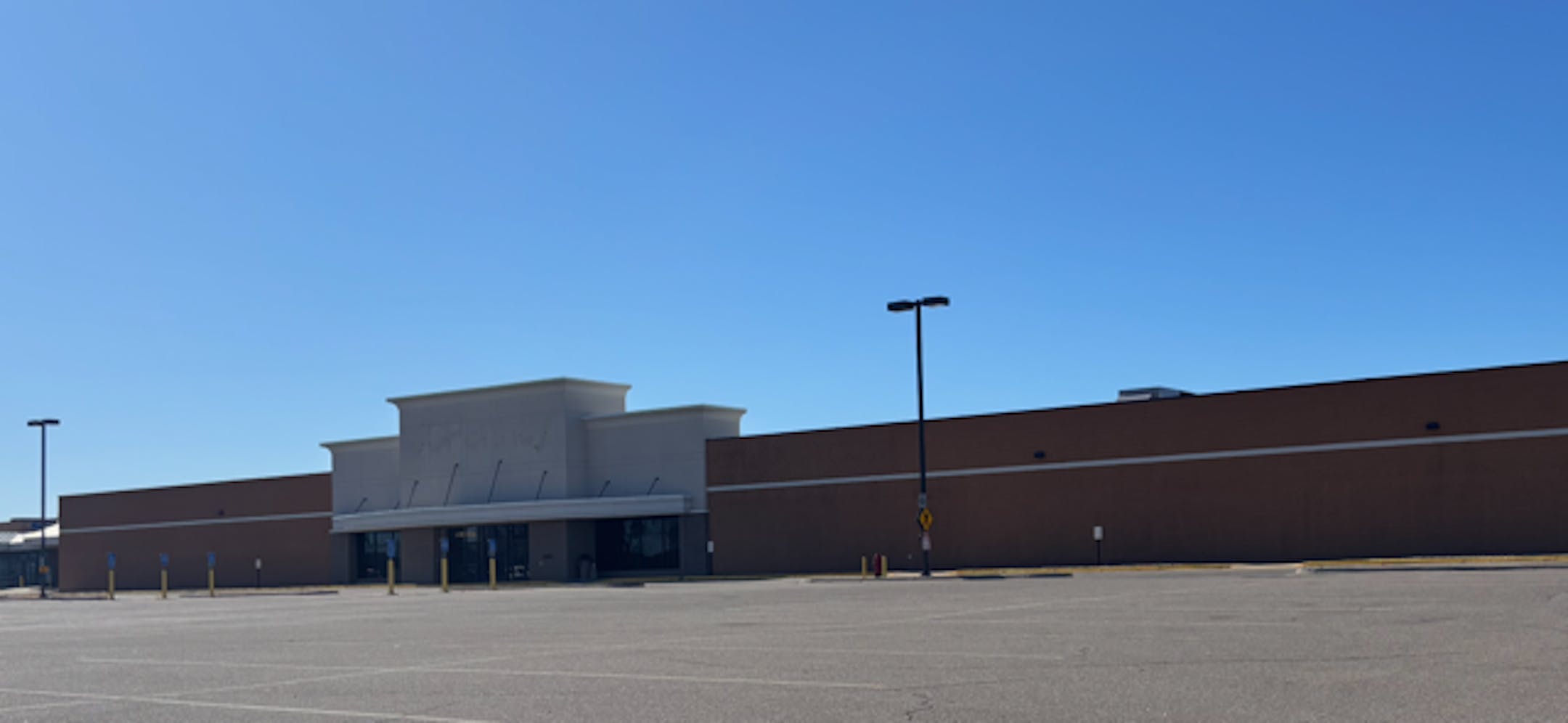A former JCPenney building stands vacant in a parking lot