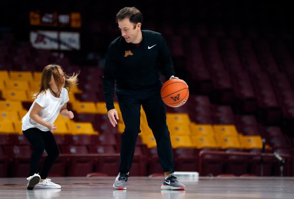 Gophers men's basketball head coach Rick Pitino played a little pickup basketball with daughter Ava before the start of the scrimmage.] Notebook from 
