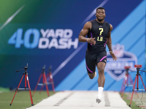 Georgia linebacker Lorenzo Carter runs the 40-yard dash at the NFL football scouting combine in Indianapolis, Sunday, March 4, 2018. (AP Photo/Michael