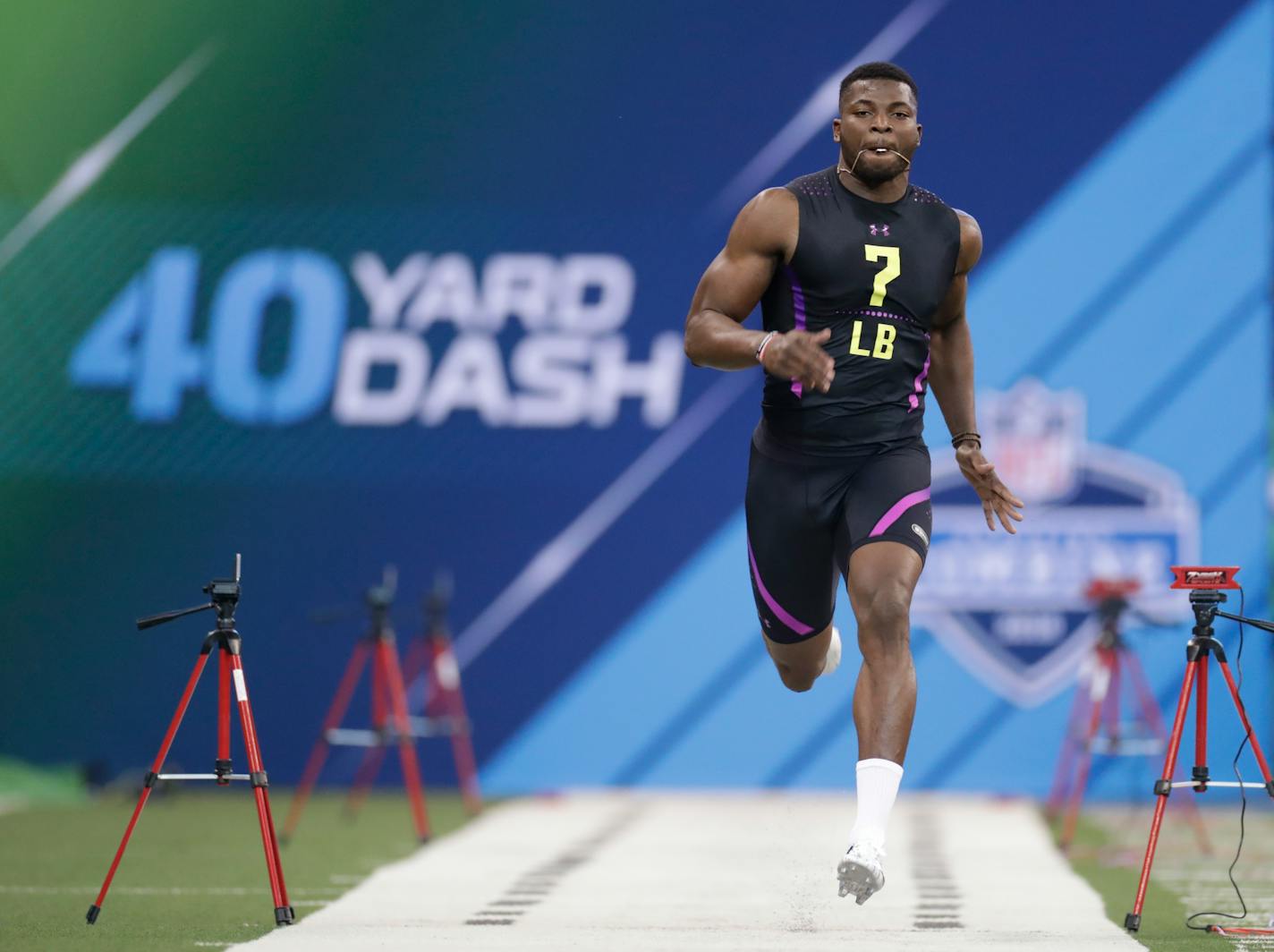 Georgia linebacker Lorenzo Carter runs the 40-yard dash at the NFL football scouting combine in Indianapolis, Sunday, March 4, 2018. (AP Photo/Michael Conroy)