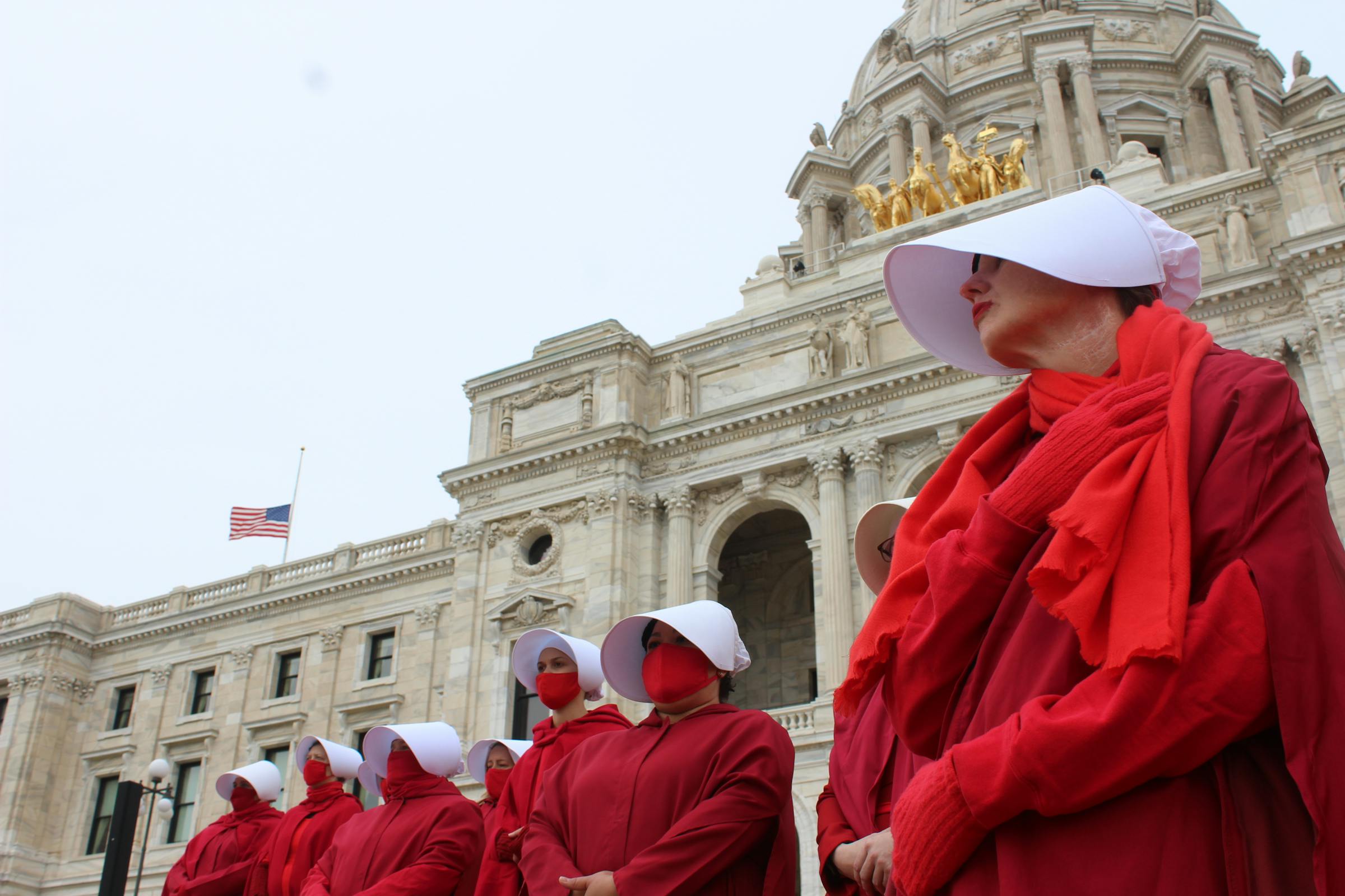 Minnesota “handmaidens” protest federal policies at State Capitol