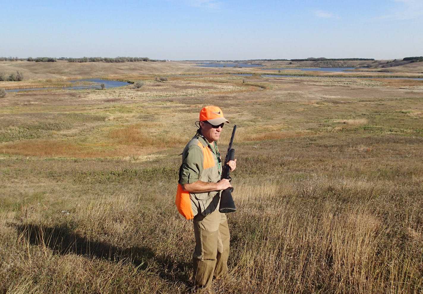 Tim McMullen of Delano hunts pheasants on public land near Aberdeen, S.D., on Monday, one of thousands of Minnesota hunters who journey west each fall to hunt ringnecks. Star Tribune photo by Doug Smith