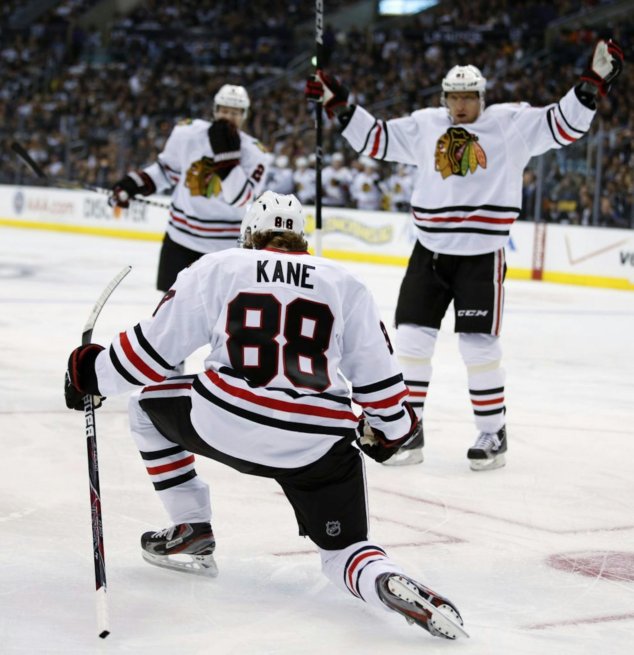 Chicago Blackhawks' Patrick Kane, foreground, celebrates his goal during the first period of an NHL hockey game against the Los Angeles Kings in Los Angeles, Saturday, Jan. 19, 2013.