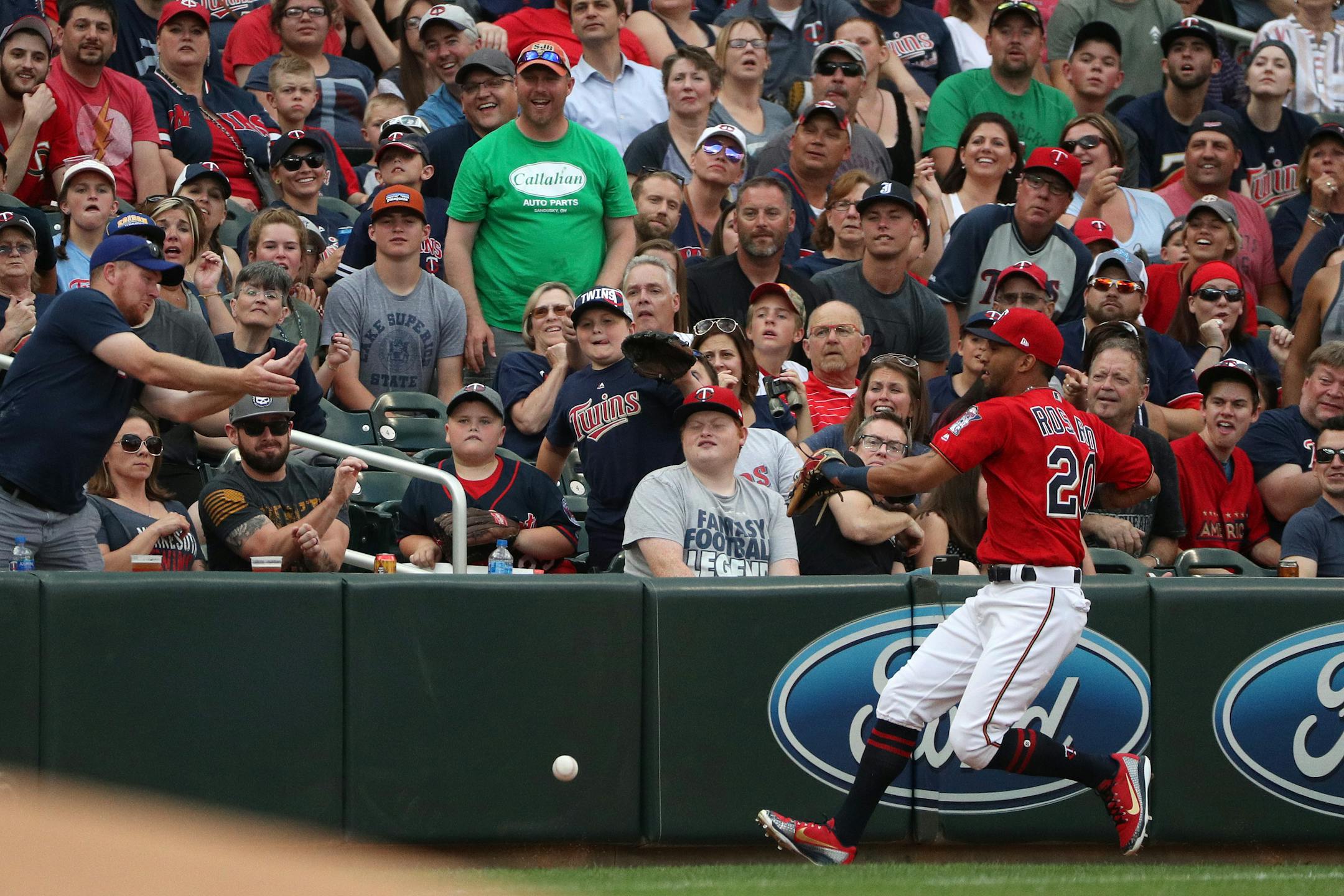 Twins left fielder Eddie Rosario chased down a ball hit by the Rangers' Shin-Soo Choo in the first inning