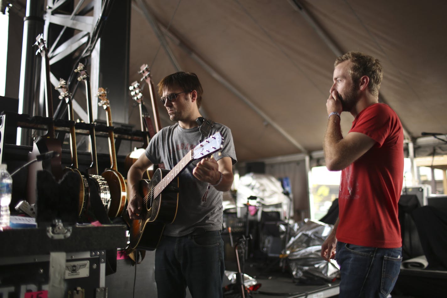 String tech Dave Feirn tuned Dave Simonett's guitar a few minutes before Trampled by Turtles played to a crowd of more than 20,000 people at the Forecastle Festival in Louisville, KY. ] JEFF WHEELER &#x201a;&#xc4;&#xa2; jeff.wheeler@startribune.com Trampled By Turtles performed at the Forecastle Festival in Louisville, Kentucky on Sunday, July 20, 2014.