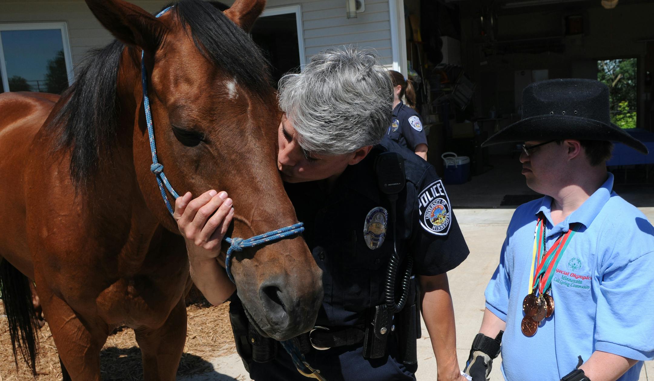Richard Sennott•rsennott@startribune.com] Zimmerman, Mn. Wednesday6/30/10 Whisper, who served as a police horse for 14 years, was retired because of a leg injury suffered in late 2008.Today whisper had a retirement party at his new home on the Decker Farm. Marianne Scheel gave her horse a kiss, she rode the horse for 5 years at the U OF M Police department