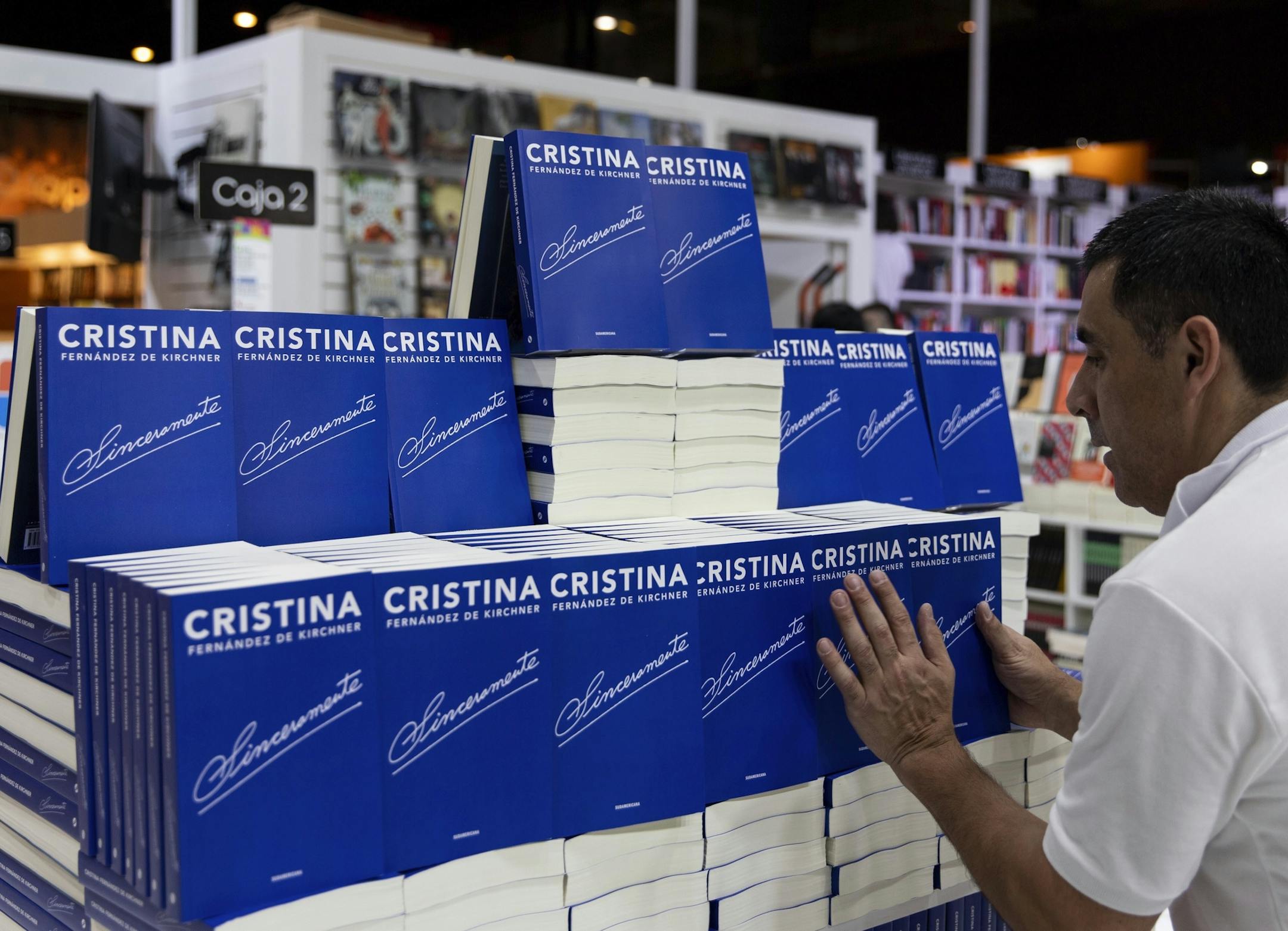 A bookstore employee arranges a display of the new book written by Argentina's former president Cristina Fernandez, at the Buenos Aires book fair, in Buenos Aires, Argentina, Friday, April 26, 2019. In what many see as a launch of her campaign to return to power, the former President looks set to shake the country's turbulent political landscape with the release of the new book. (AP Photo/Tomas F. Cuesta) ORG XMIT: XTC103