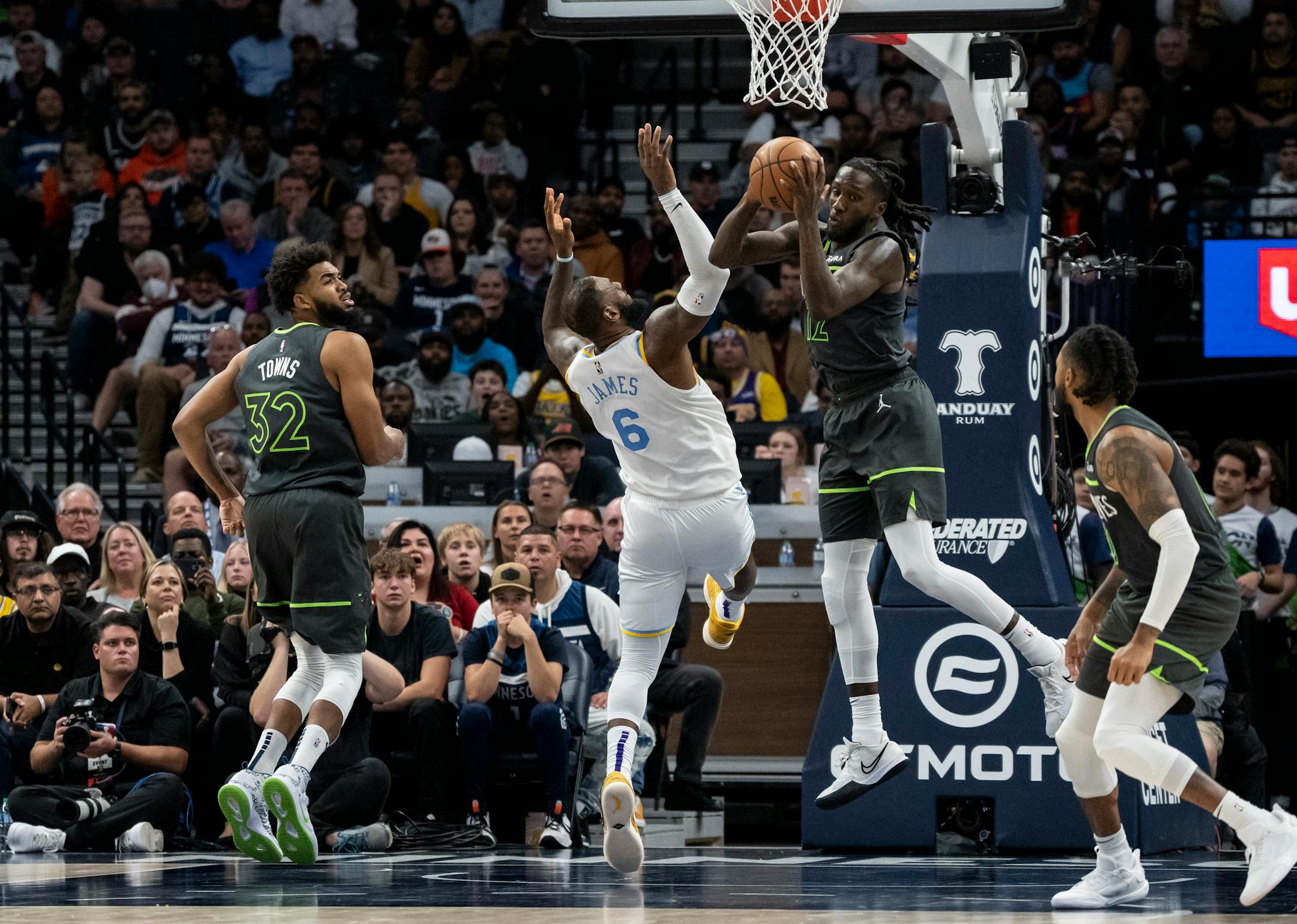 Minnesota Timberwolves forward Taurean Prince (12) grabs the rebound from Los Angeles Lakers forward LeBron James (6) in the fourth quarter.