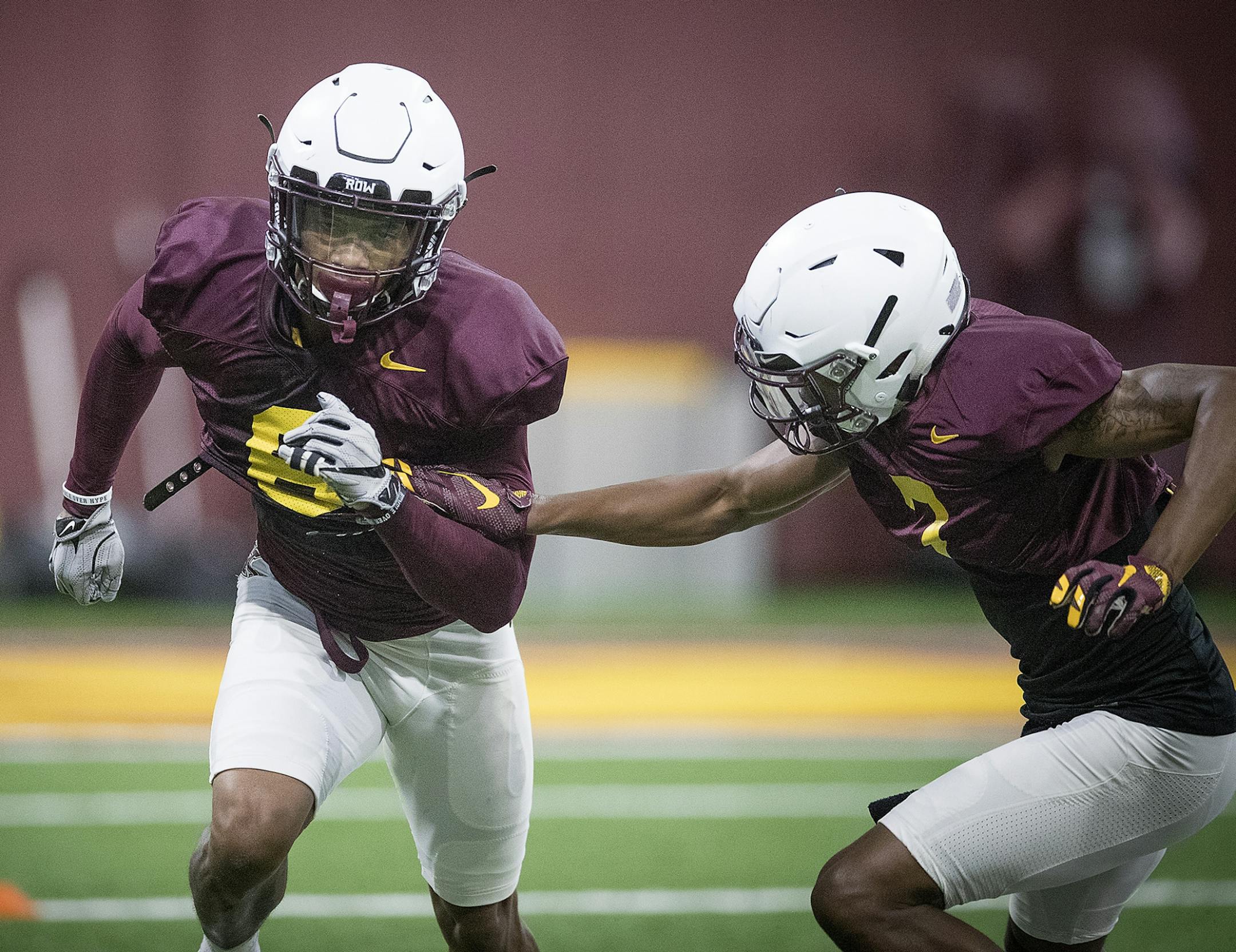 Minnesota's defensive back Chris Williamson, left, took to the field for the first practice that was open to the public at the Athletes Village at the University of Minnesota in Minneapolis, MN.