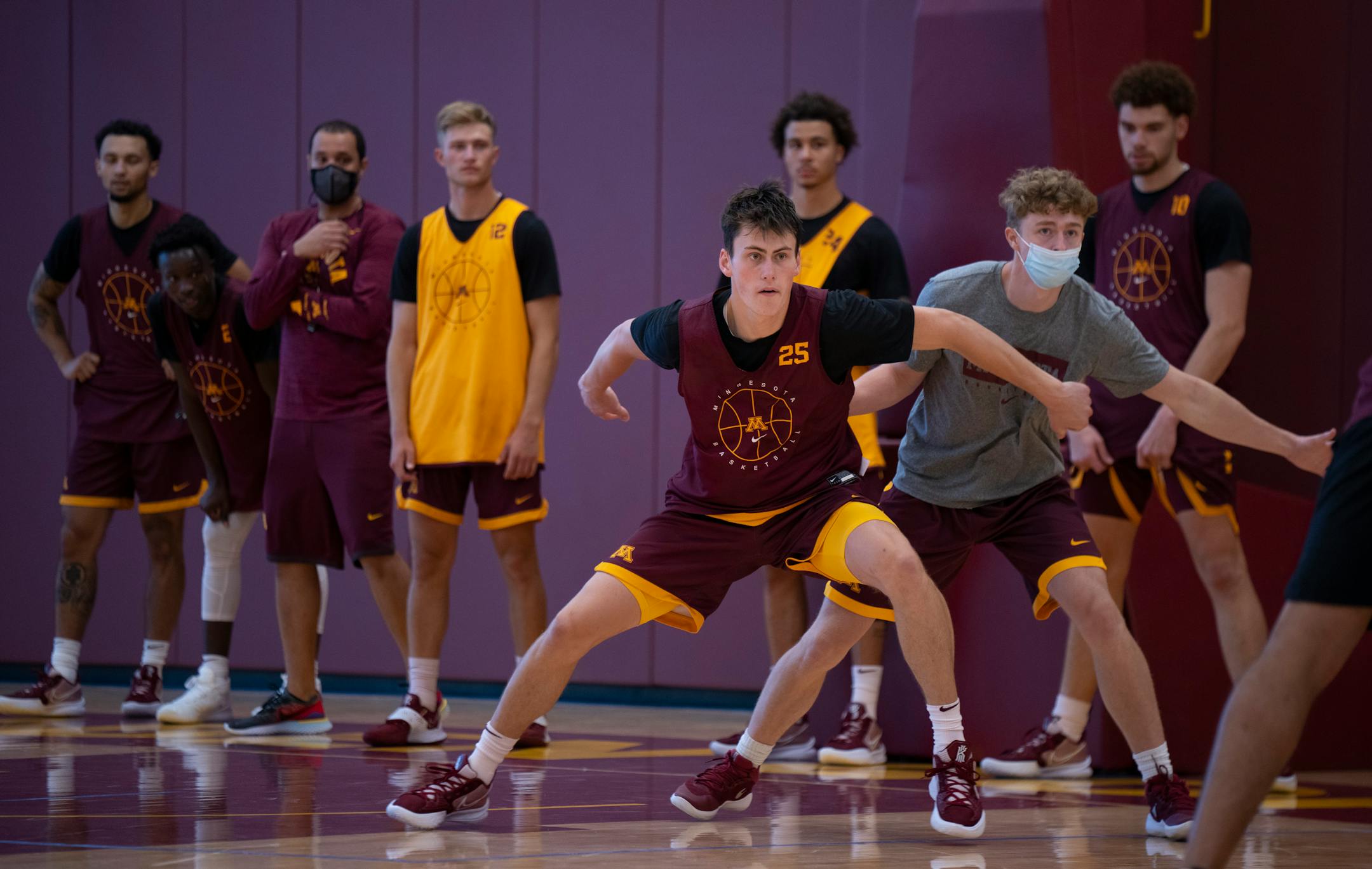 Walk on guard Will Ramberg (25) took part in a drill with student manager Jackson Sutherlin during practice Tuesday.