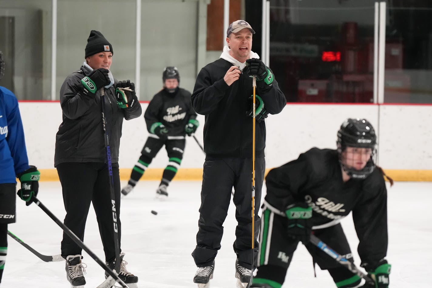 John Pohl and Krissy Wendell Pohl coach the Hill Murray girls hockey team at Polar Ice Arena Wednesday, Jan. 10, 2024 North St. Paul, Minn. Feature about Hill-Murray girls hockey, coached by husband and wife John Pohl and Krissy Wendell Pohl. Among their highest scorers is their ninth-grade daughter, Emily Pohl. ] GLEN STUBBE • glen.stubbe@startribune.com