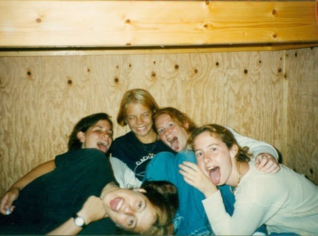 Best friends Carrie Bush, top left, and Abbey Bryduck, second from right, met at YMCA Camp Icaghowan in Amery, Wis., when they were camp counselors in the mid-1990s. 