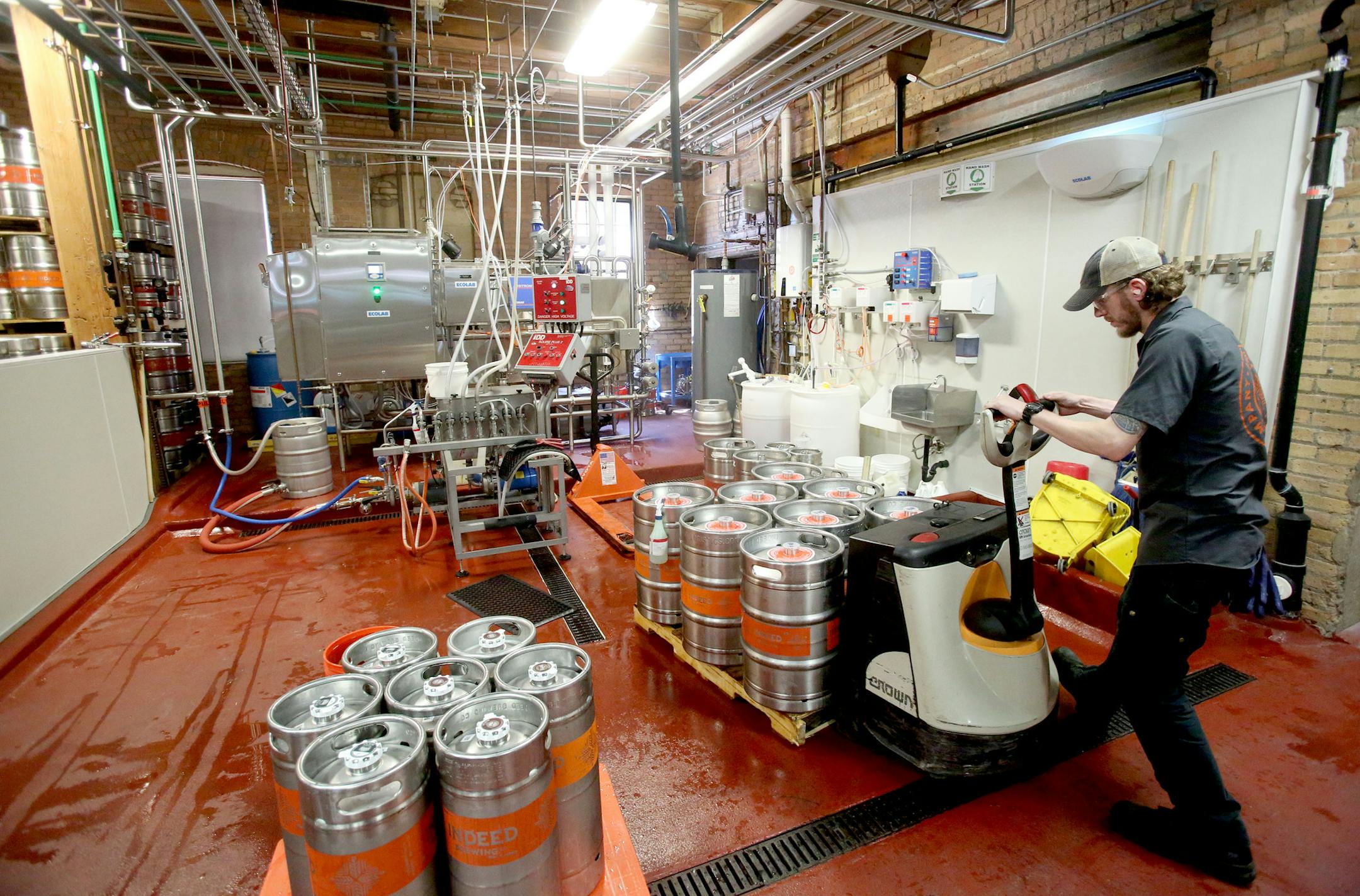 A worker moves beer barrels in front of the "clean in place" system that Ecolab installed at Indeed Brewing and was seen Wednesday, July 13, 2016, at Indeed Brewing Co. in Minneapolis, MN.](DAVID JOLES/STARTRIBUNE)djoles@startribune It's been two years since Ecolab decided to pounce into the craft brewery cleaning business. Now it's on full tap and has big plans for future growth. Indeed Brewing was one of its first micro brewing clients back in 2012.