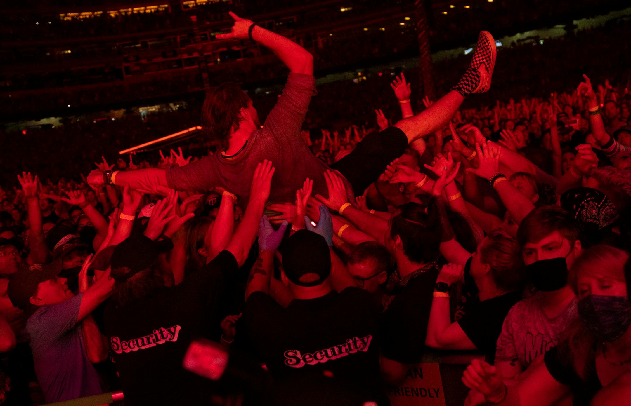 A fan crowd surfed while Green Day performed at the Hella Mega Tour at Target Field in Minneapolis on Monday.