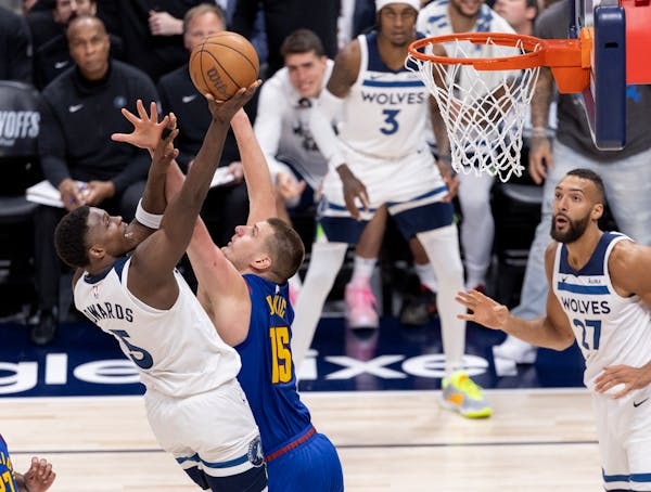 Anthony Edwards put up a shot over Nikola Jokic in the fourth quarter of Game 1 on Saturday in Denver.