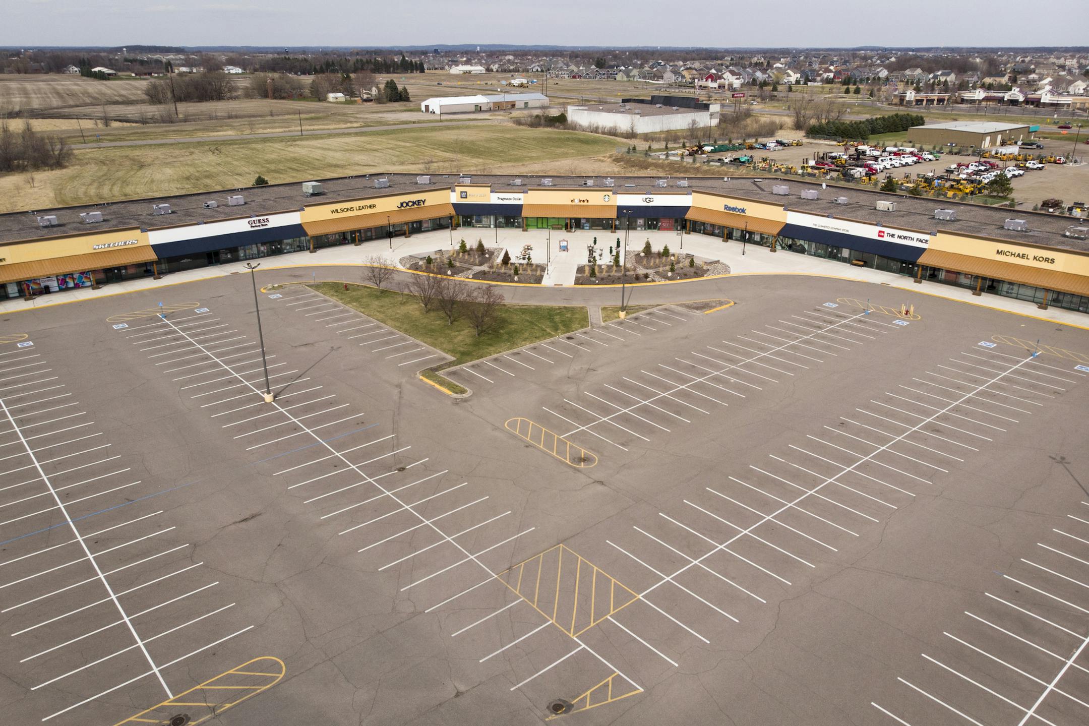 The parking lot at the Albertville Premium Outlets was empty Saturday afternoon as businesses remain closed due to the coronavirus. ] aaron.lavinsky@startribune.com The empty parking lot at the Albertville Premium Outlets on Saturday, April 11, 2020 in Albertville, Minn.