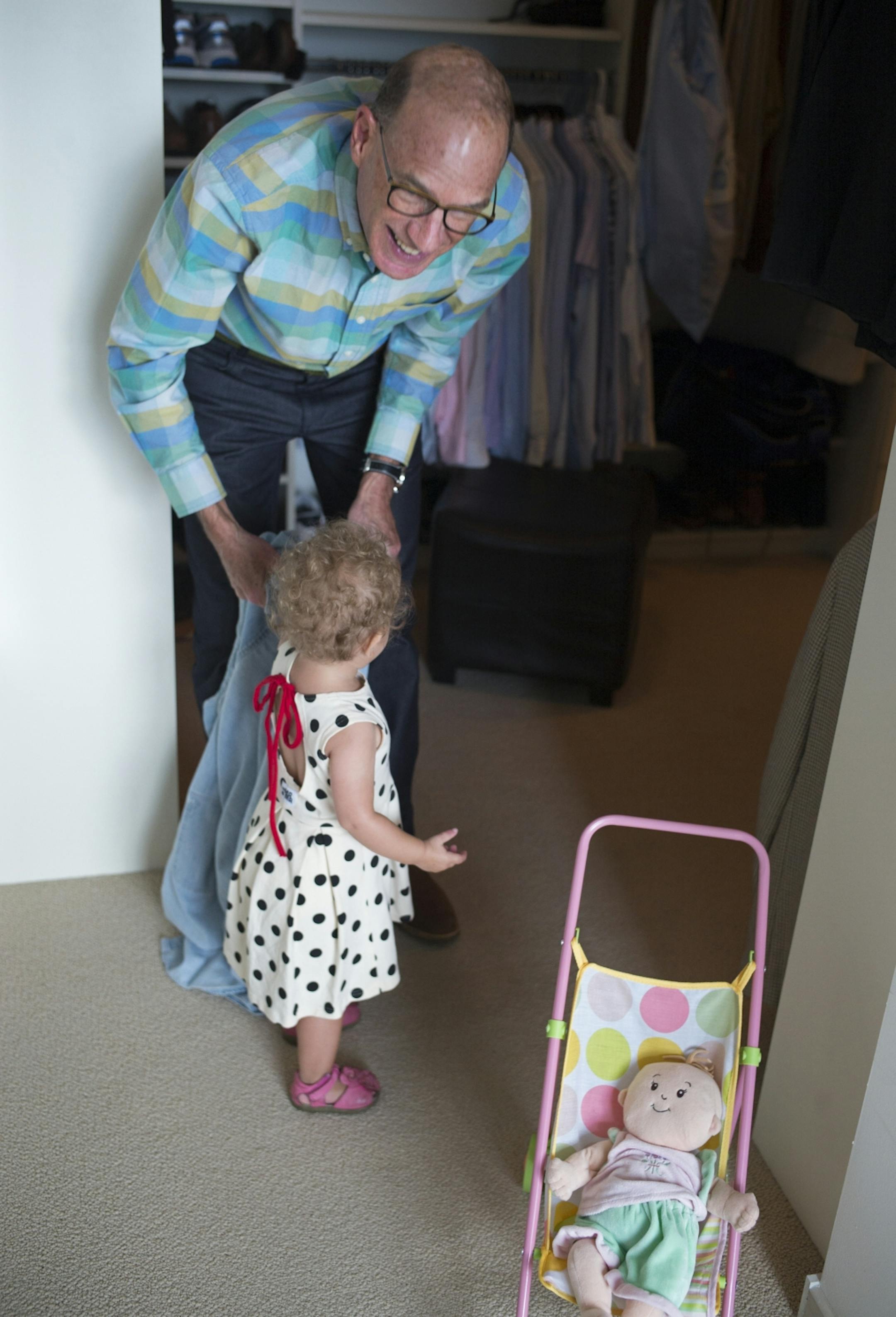 Rozlyn Gerber and her grandfather Hart Kuller play before dinner.
