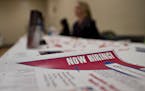 Job information sheets sit on an employer's table during a Princeton Area Chamber of Commerce job fair in Princeton, Illinois, U.S., on Monday, Jan. 5