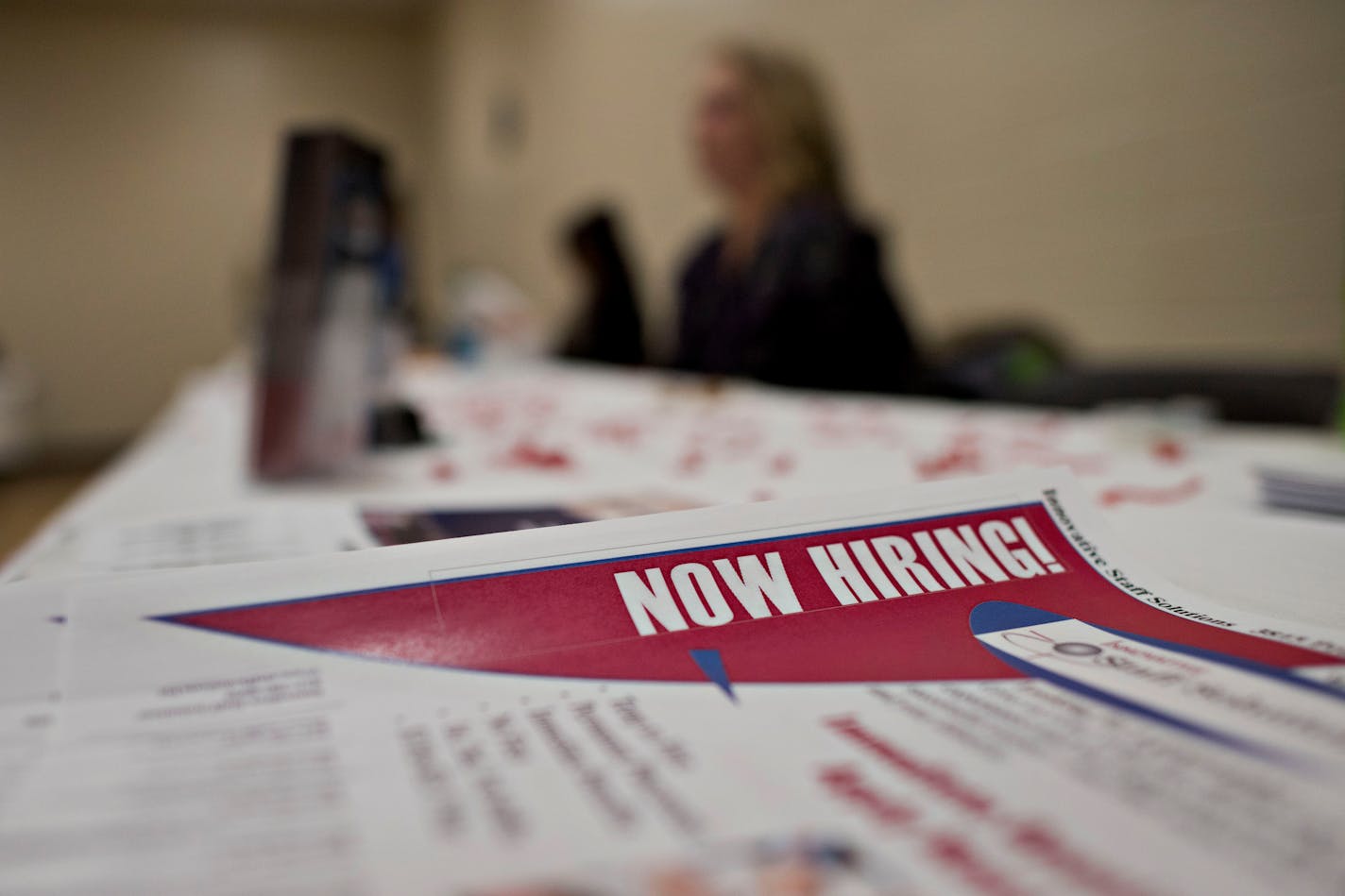 Job information sheets sit on an employer's table during a Princeton Area Chamber of Commerce job fair in Princeton, Illinois, U.S., on Monday, Jan. 5, 2015. The U.S. Department of Labor is scheduled to release initial jobless claims figures on Jan. 9. Photographer: Daniel Acker/Bloomberg