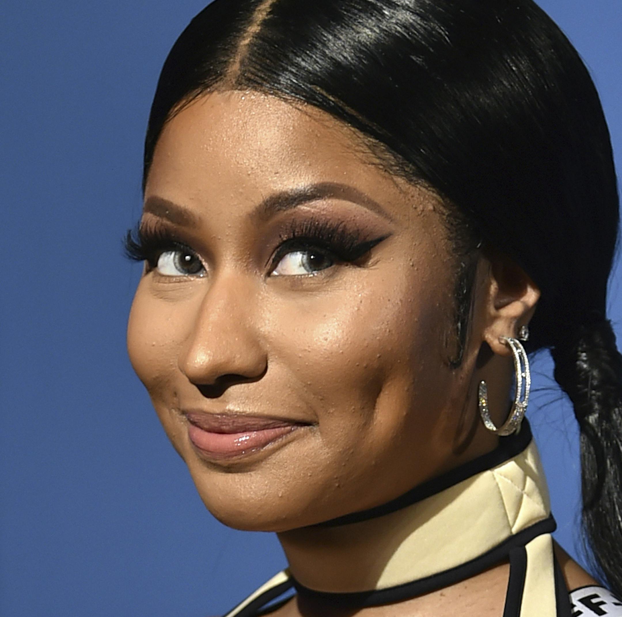 FILE - This Aug. 20, 2018 file photo shows Nicki Minaj at the MTV Video Music Awards in New York. Minaj has a new release coming soon: her first child. The rapper took to Instagram on Monday, July 20, 2020, to announce she is pregnant, posting photos of herself with a baby bump. One caption simply read: "#Preggers." (Photo by Evan Agostini/Invision/AP, File)