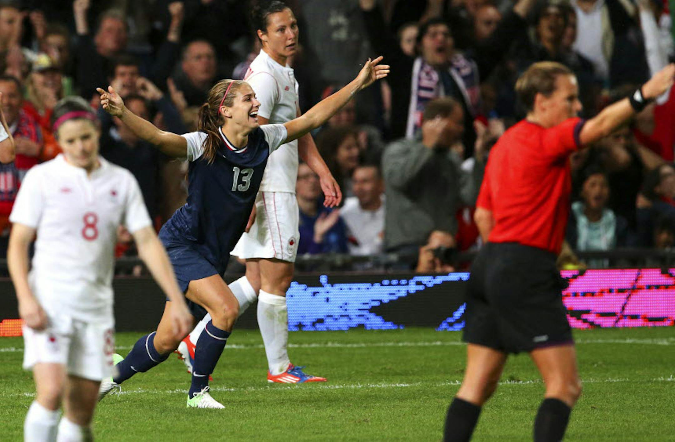 U.S. forward Alex Morgan (13) celebrates after scoring the game-winning goal against Canada during the women's soccer semifinals.