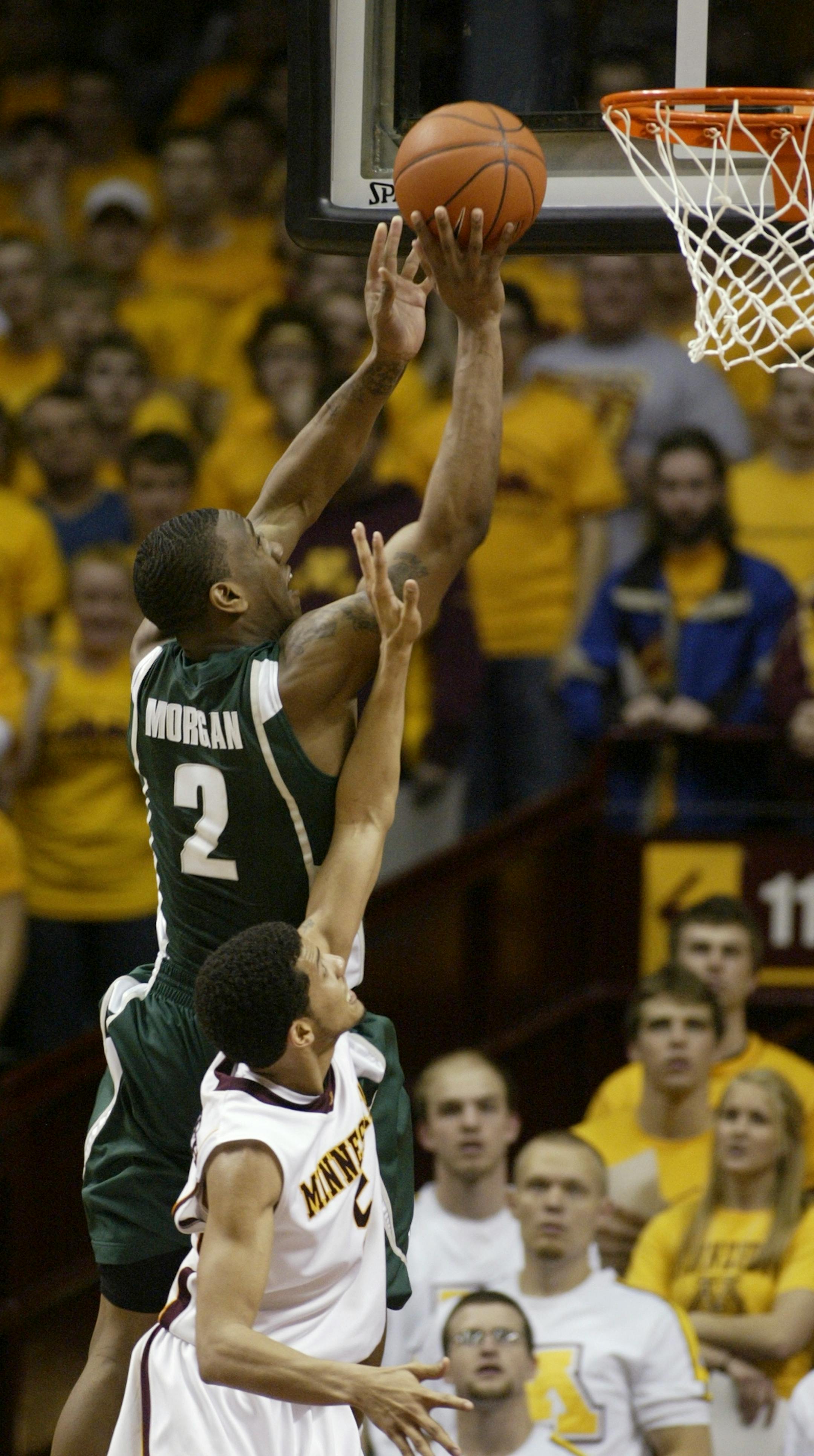 Michigan State forward Raymar Morgan shot against Gophers guard Devoe Joseph during the second half. Morgan made the basket and Joseph was called for a foul, resulting in a three-point play.
