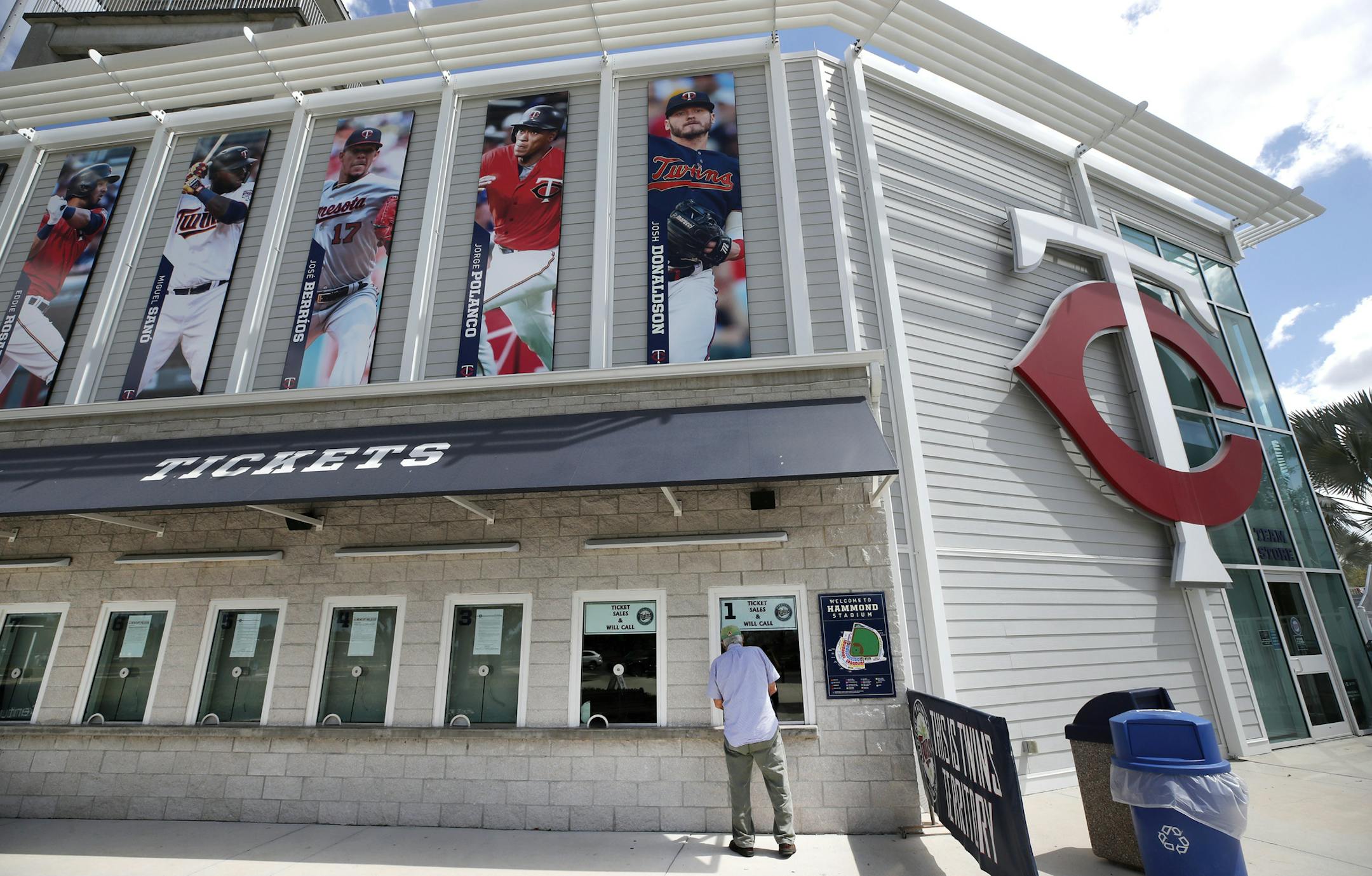 A ticket holder inquires about a refund at the Minnesota Twins' Hammond Stadium, Friday, March 13, 2020, in Fort Myers, Fla. Major League Baseball has suspended the rest of its spring training game schedule because of the coronavirus outbreak. The league is also delaying the start of its regular season by at least two weeks. (AP Photo/Elise Amendola)