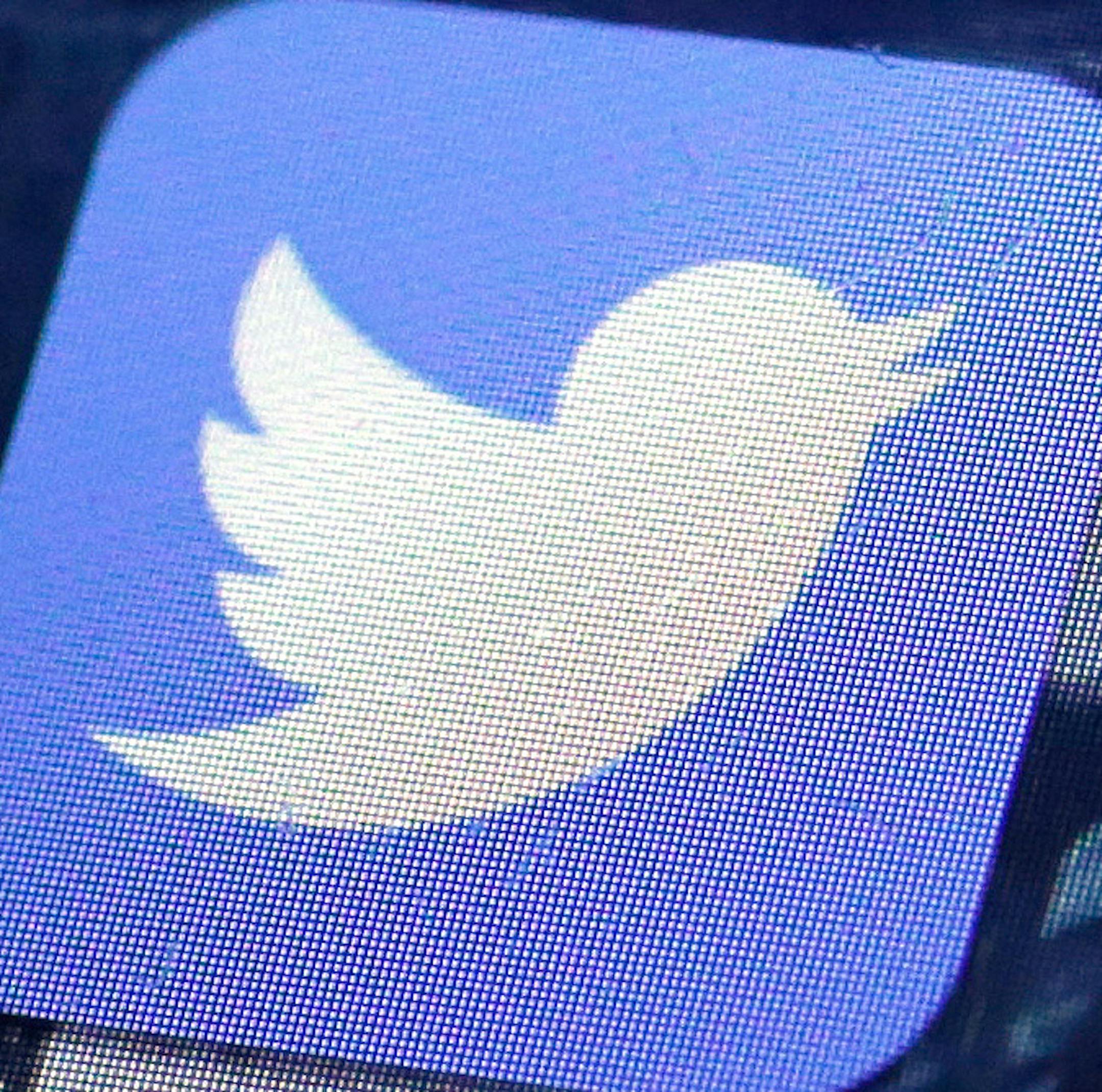 CORRECTS TO READ 'UP TO' 336 EMPLOYEES INSTEAD OF 366 - FILE - This Friday, Oct. 18, 2013, file photo, shows a Twitter app on an iPhone screen, in New York. Twitter on Tuesday, Oct. 13, 2015 announced the company is laying off up to 336 employees, signaling CEO Jack Dorsey's resolve to slash costs while the company struggles to make money. (AP Photo/Richard Drew, File)