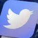 CORRECTS TO READ 'UP TO' 336 EMPLOYEES INSTEAD OF 366 - FILE - This Friday, Oct. 18, 2013, file photo, shows a Twitter app on an iPhone screen, in New