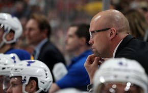 St. Louis Blues head coach Mike Yeo watched from the bench in the second period.