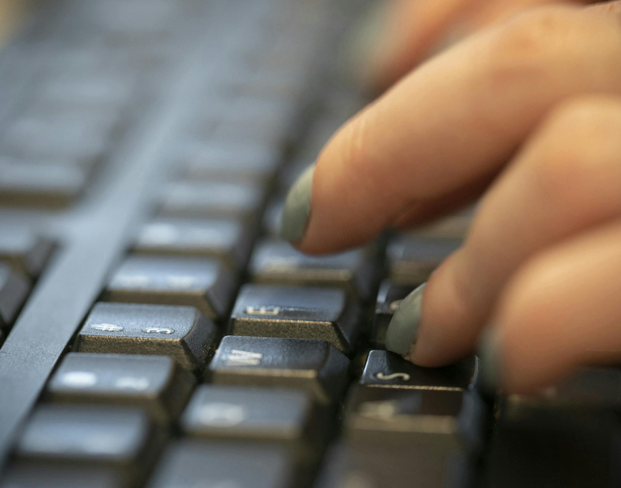 FILE - In this Oct. 8, 2019, file photo a woman types on a keyboard in New York. Larry Tesler, the Silicon Valley pioneer who created the now-ubiquitous computer concepts such as “cut,” “copy” and “paste,” has died. He was 74. (AP Photo/Jenny Kane, File)