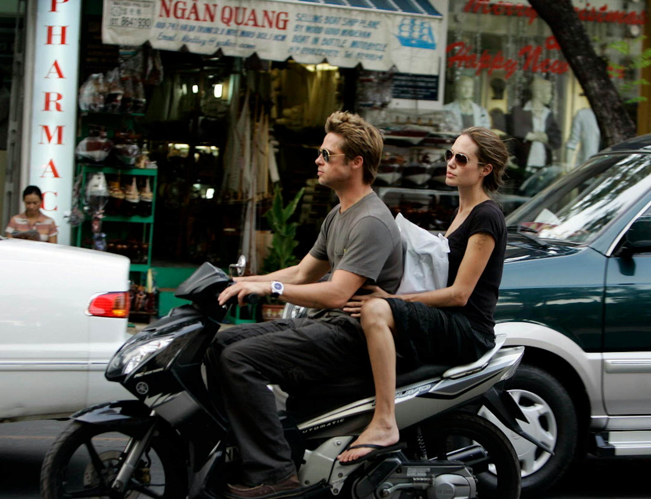 Brad Pitt and Angelina Jolie spent Thanksgiving, Thursday, Nov. 23, 2006 cruising on a motorbike while touring Ho Chi Minh City, Vietnam. Prior to arriving in Vietnam, the couple made a surprise visit to Cambodia where they visited a former Khmer Rouge death camp, now a genocide museum.