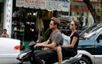 Brad Pitt and Angelina Jolie spent Thanksgiving, Thursday, Nov. 23, 2006 cruising on a motorbike while touring Ho Chi Minh City, Vietnam. Prior to arr